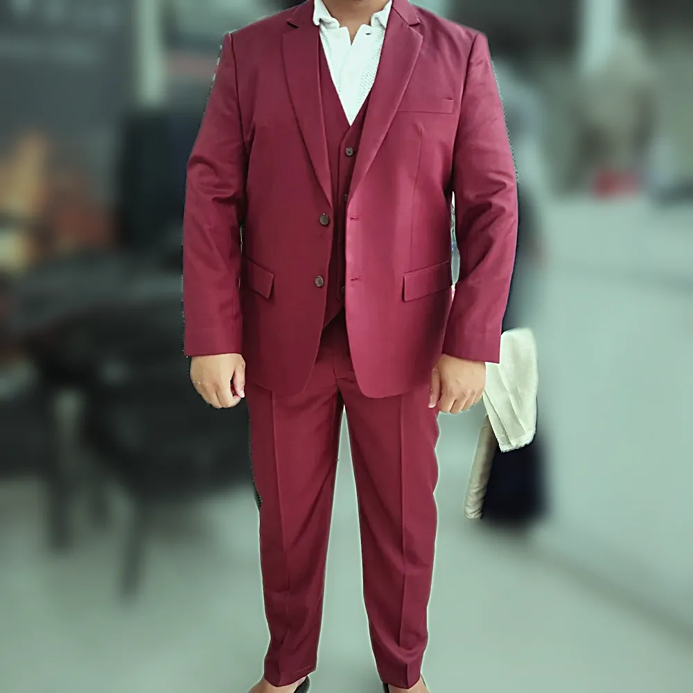 A burgundy three-piece suit with a matching waistcoat, worn in the shop