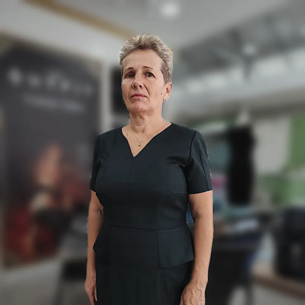 A dark green fitted dress with a V neckline and a shaped waist seam