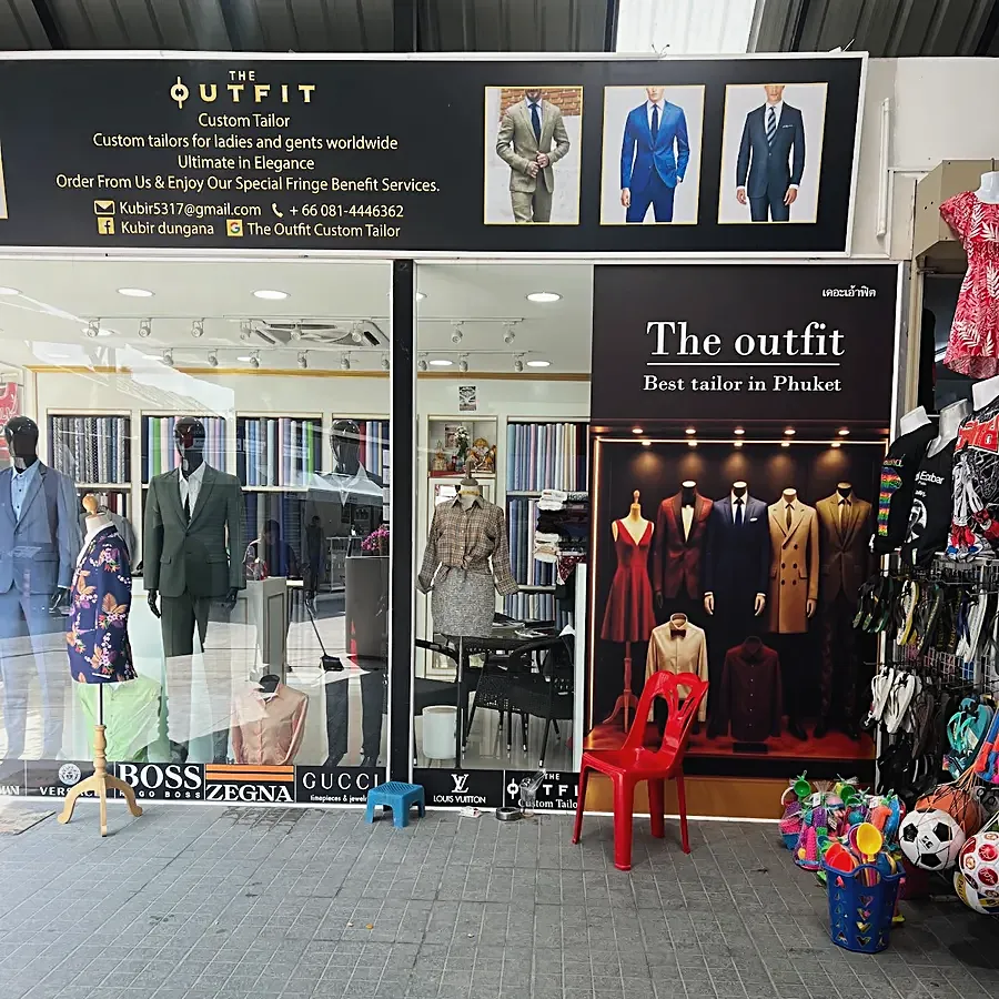 The shopfront, suits on mannequins behind the glass and the shop banner above — from Andy Burge's review