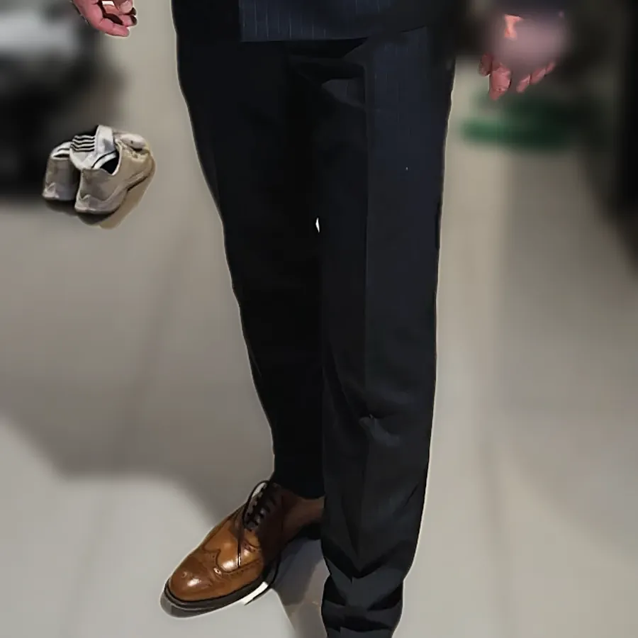 Navy suit trousers and brown brogues, seen from the knee down — from James Gibson's review